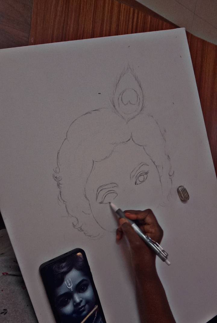 Outlining the baby krishna painting